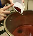 Adding Cochineal to Water